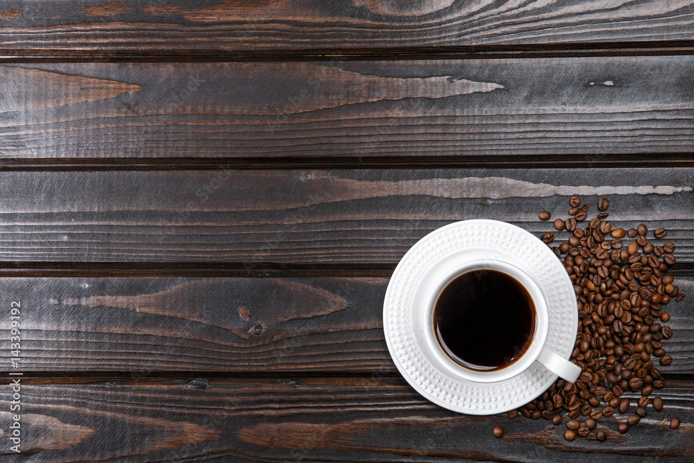 Top view of coffee cup on a wood background with copy space. Top view of coffee cup on a wood background with copy space.