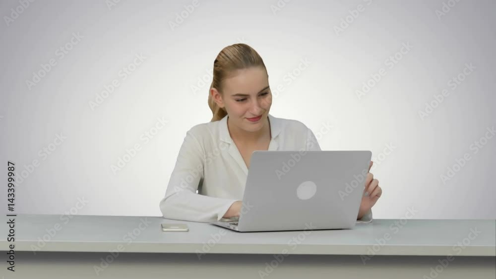 Woman enjoy a good day at job place, dancing and singing on white background. Woman enjoy a good day at job place, dancing and singing on white background.