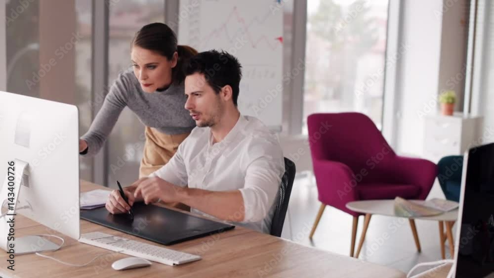 Female coworker giving documents to boss Female coworker giving documents to boss