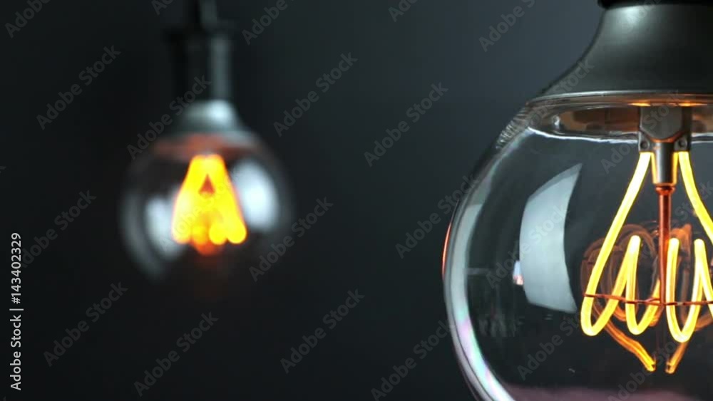 retro vintage light bulb with led technology built-in with change focus on vintage light bulb in background, energy saving with old style atmosphere concept