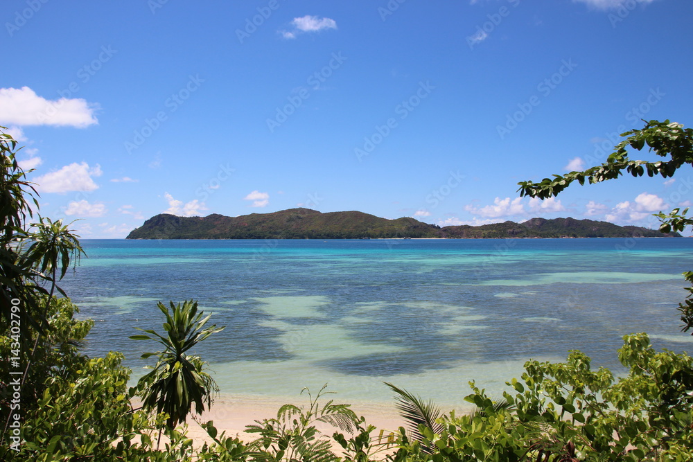 Anse Takamaka, Praslin Island, Seychelles, Indian Ocean, Africa / View to Curieuse Island.