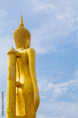 Big buddha statue over scenic blue sky background at Wat Klong reua. Phitsanulok, Thailand. photo