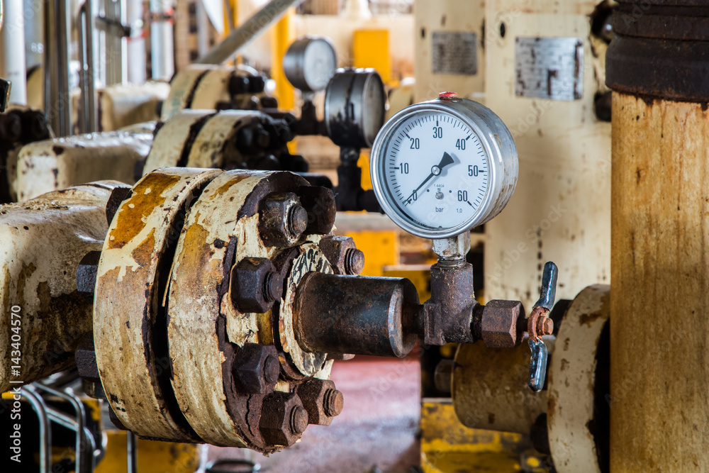 Closeup of pressure gauge , pressure gauge measuring gas pressure. Pipes and valves at oil and gas industrial plant. Closeup of pressure gauge , pressure gauge measuring gas pressure. Pipes and valves at oil and gas industrial plant.