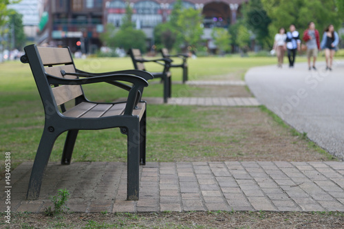 View of the benches beside the park sidewalk © aozora