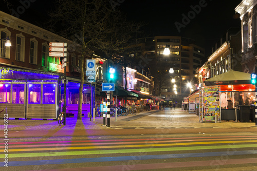 Pubs and restaurants in the city center at Night. Colorful stripes crossing. Netherlands town of Tilburg 26.01.2017