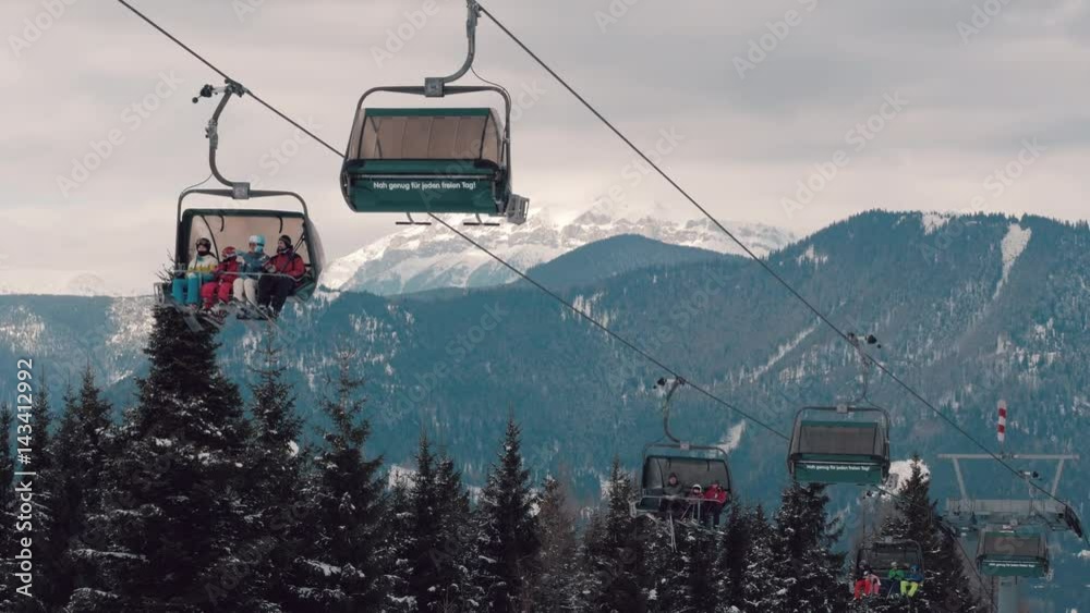 Chair lift with snowy mountain view at ski resort in Austria Chair lift with snowy mountain view at ski resort in Austria