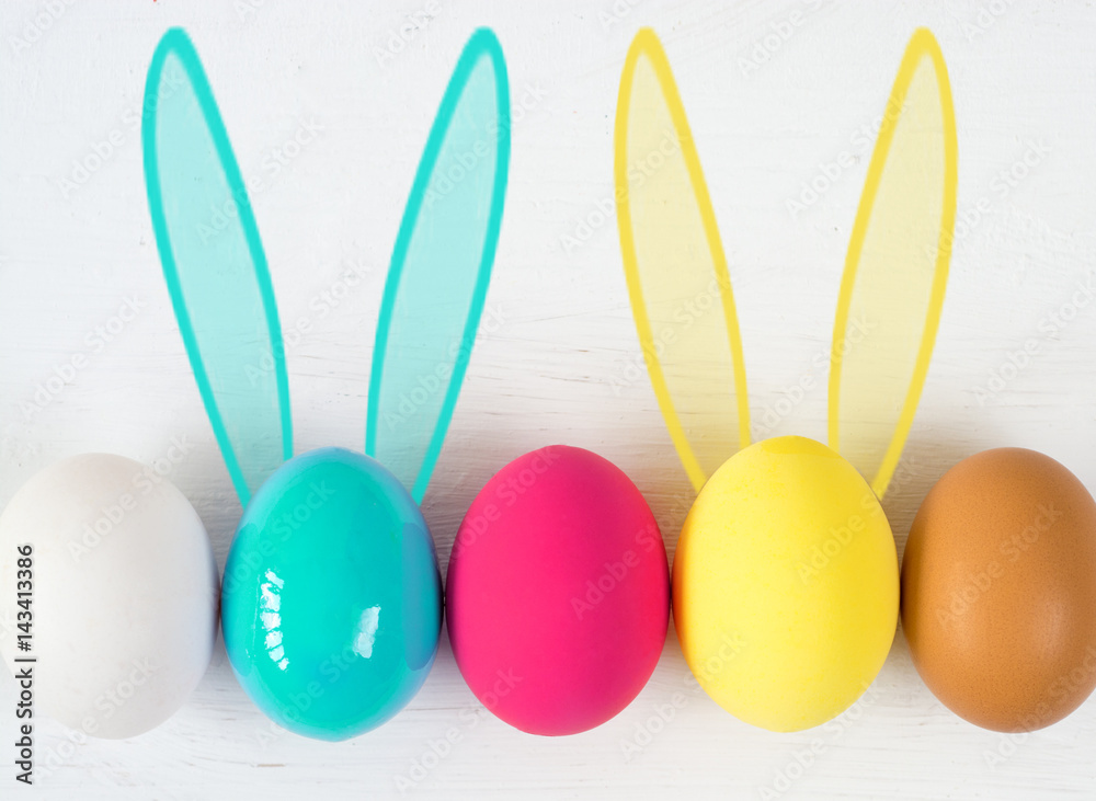 Easter eggs with Rabbit ears in colored buckets on white, selective focus image, Card Happy Easter Easter eggs with Rabbit ears in colored buckets on white, selective focus image, Card Happy Easter