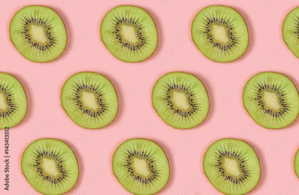 Pattern of kiwi Fruits on pink Background, similar slices Pattern of kiwi Fruits on pink Background, similar slices