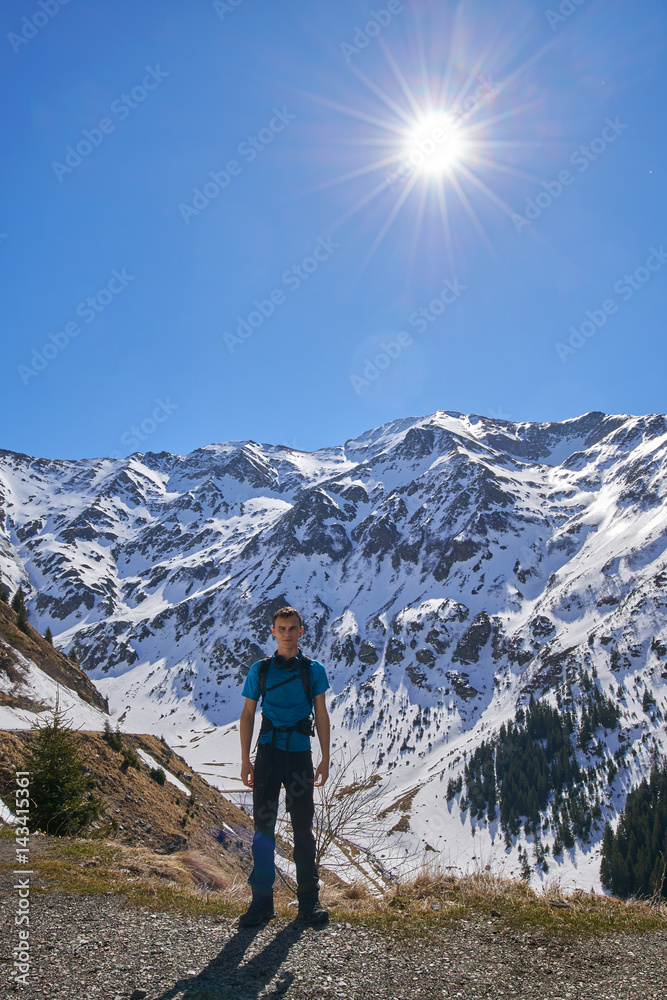 Teenager hiking into the mountains