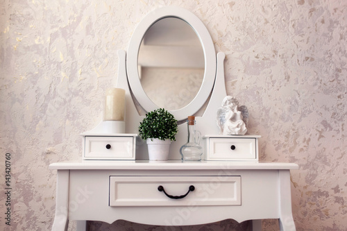 Valokuvatapetti Beautiful wooden dressing table with mirror on white background wallpaper