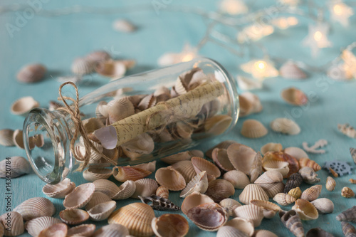 Bottle with a message, seashells. Marine concept.