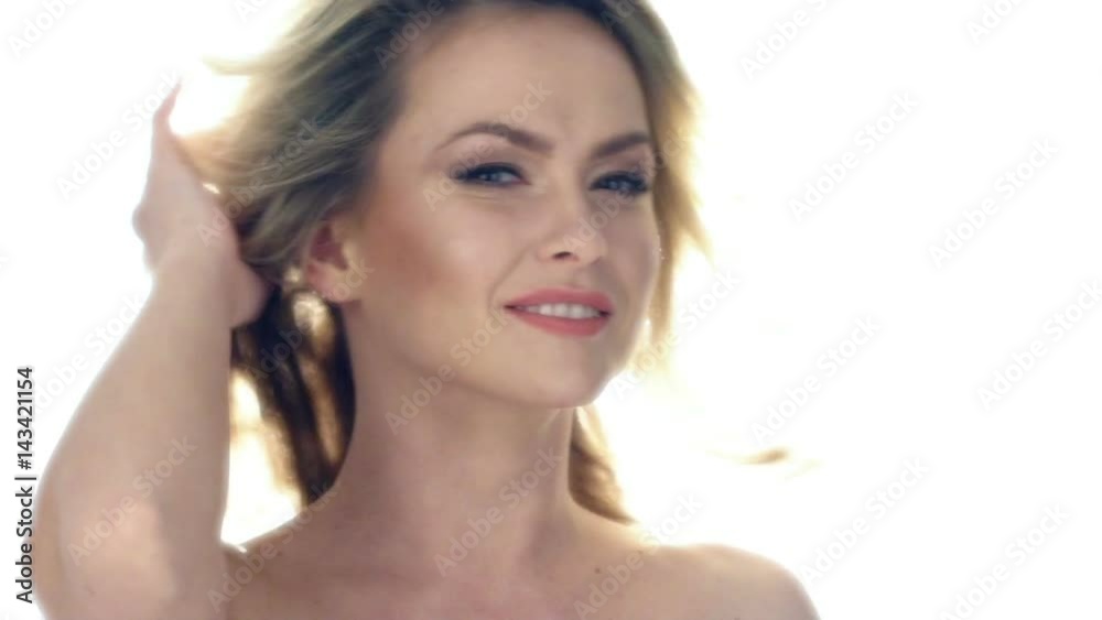 Beautiful young woman laughing in rays of sun. Slow motion video. Beautiful young woman laughing in rays of sun. Slow motion video.