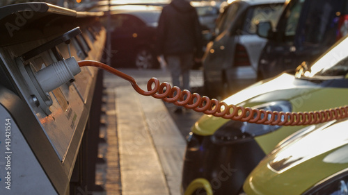 Power supply for electric car charging. City electric car charging station. Close-up.