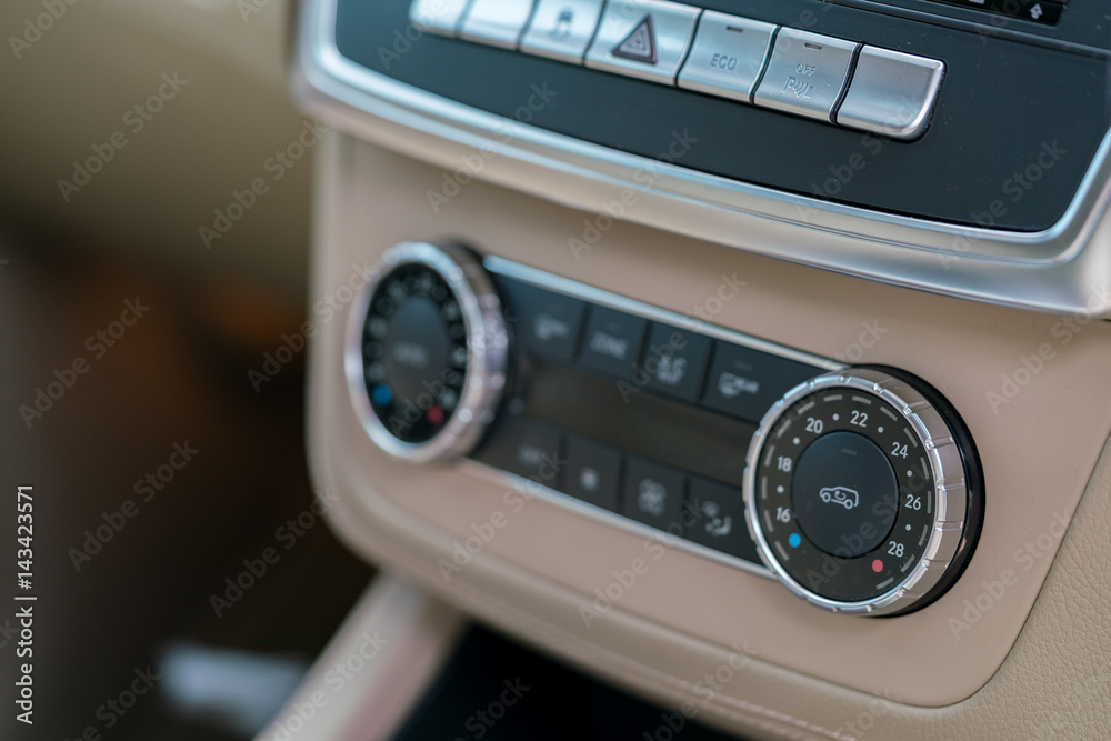Air conditioner switch in luxury car ; Interior detail. - air flow controller Air conditioner switch in luxury car ; Interior detail. - air flow controller