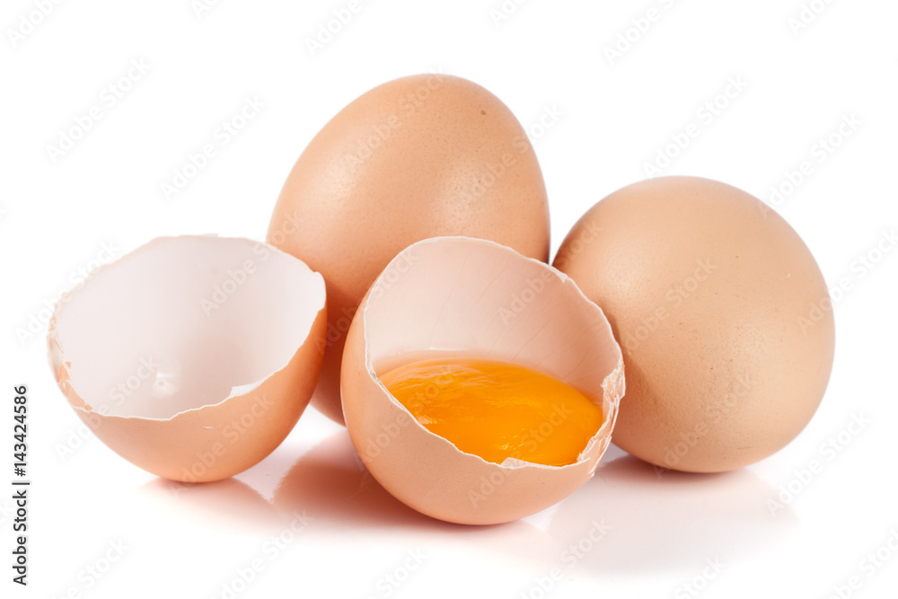 two whole eggs and broken egg isolated on white background