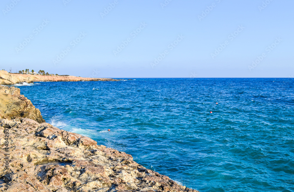 Stony sea shore on a sunny day. Cyprus