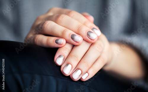 Stylish gray manicure with overflowing  Fashion  hands  fingers