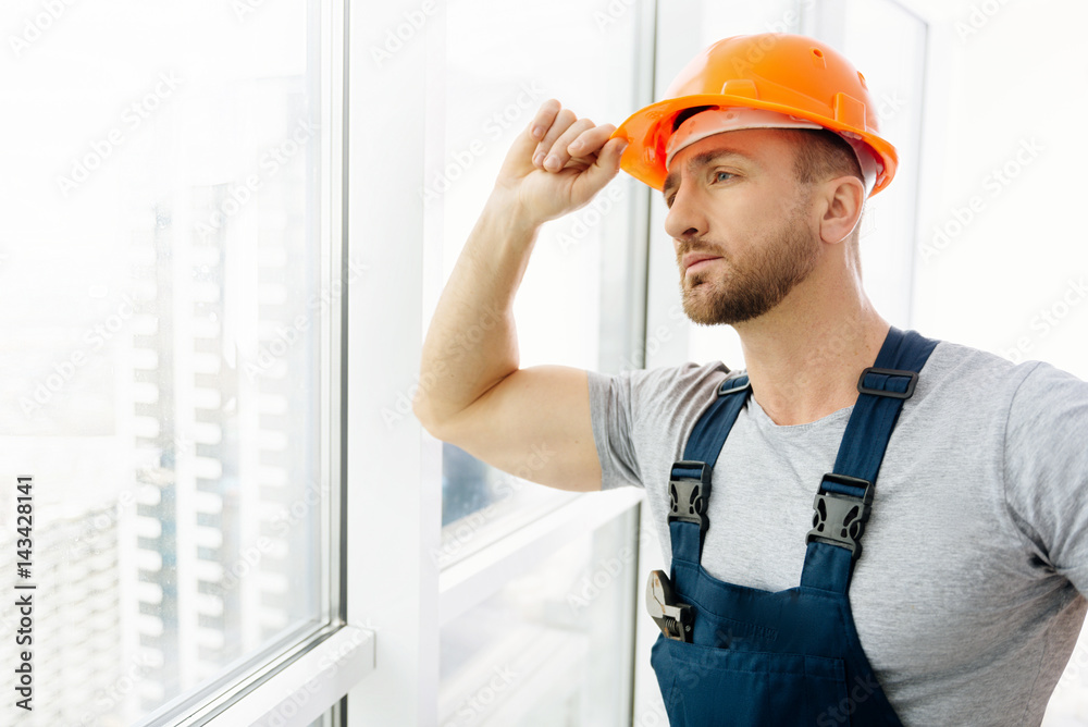 Waist up of construction engineer standing in the office Waist up of construction engineer standing in the office