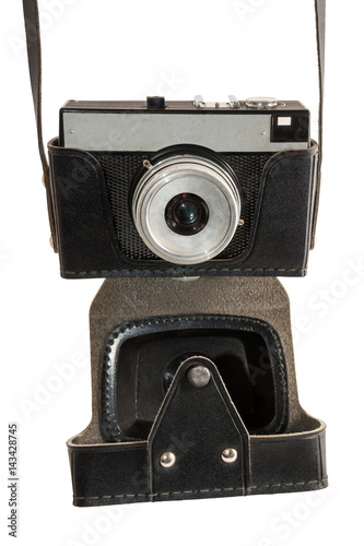 Old used dirty old-fashioned film photocamera front view with a cover