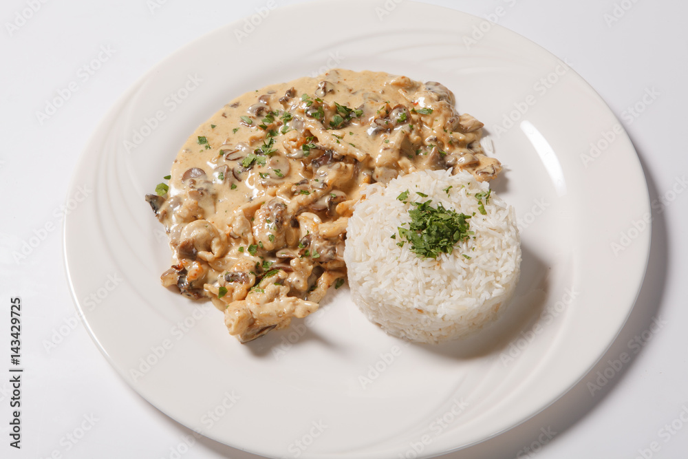 stewed chicken with white rice and mashroom sauce