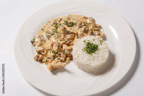stewed chicken with white rice and mashroom sauce