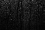 Part of series. Background photo of rain drops on dark glass, different size: small medium and large