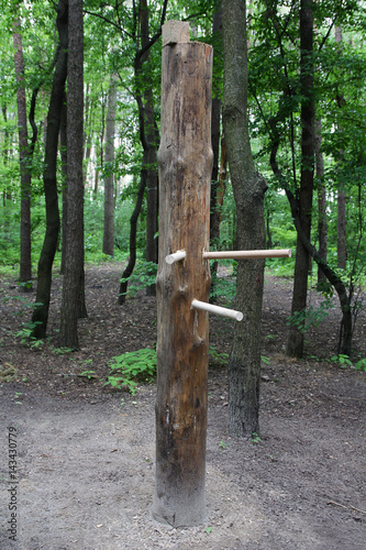 Wooden martial arts equipment in the city park photo