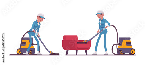 Female janitor vacuum cleaning indoors