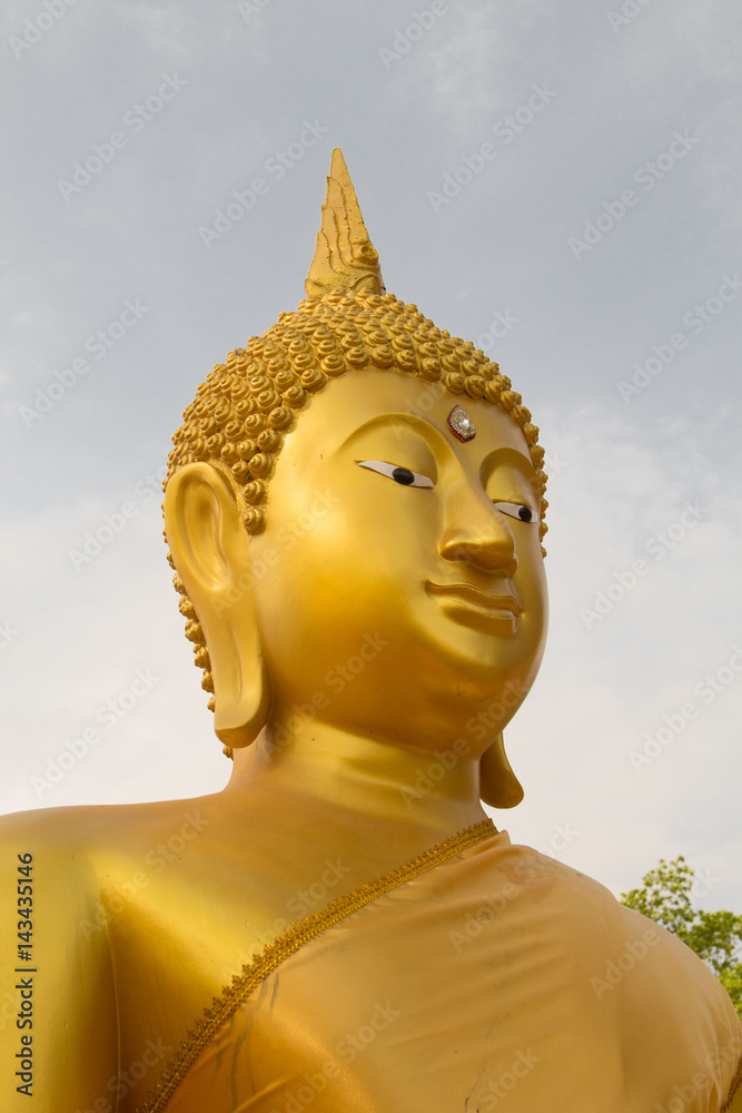 Face of big golden buddha statue in Thailand (Phichit, Thailand)