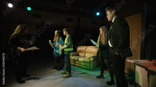  Young student actors in rehearsal for school theatre production photo