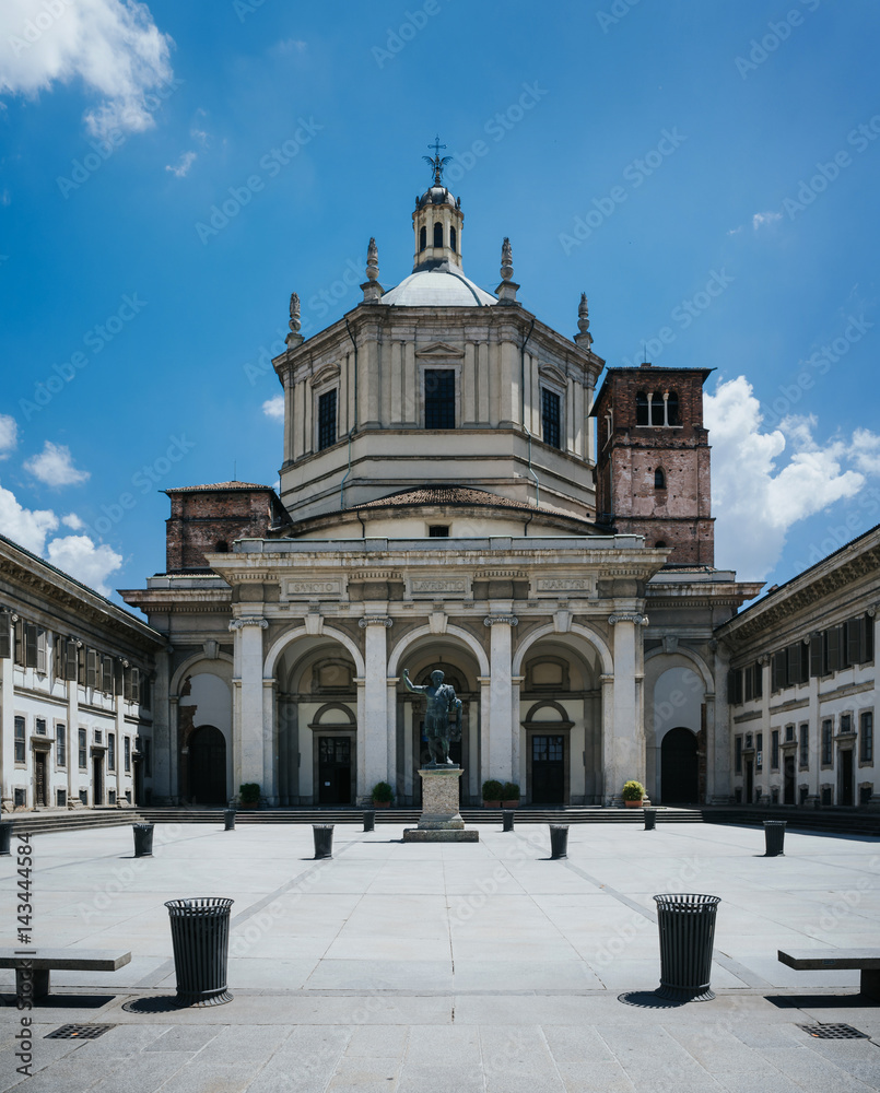 Facade of San Lorenzo Maggiore Basilica (Saint Lawrence the Major Cathedral) and statue of Constantine emperror in front. Nice travel destination postcard.