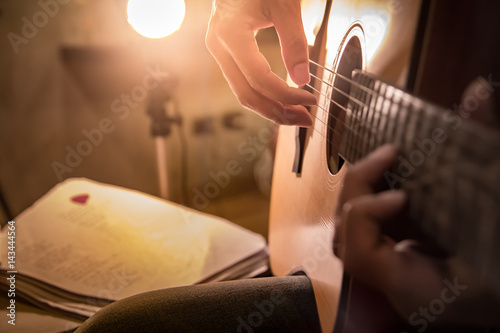 A man is playing a guitar, guitarist, musician