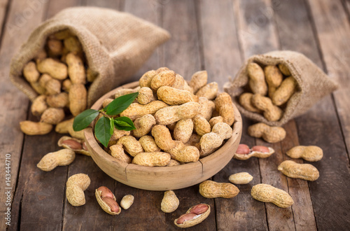 Fresh organic peanuts in the bowl photo