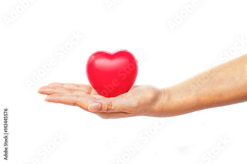 hand holding a red heart on white background