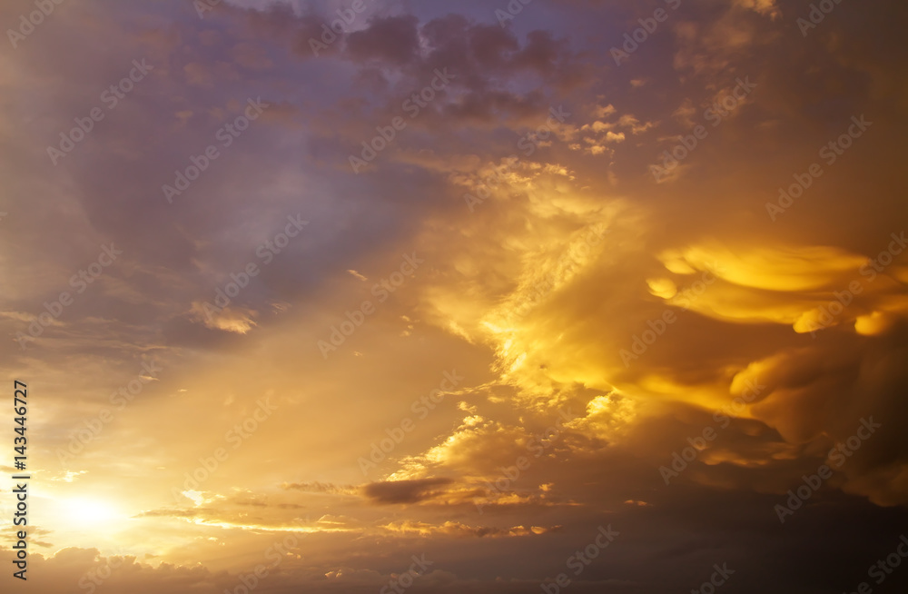 Beautiful dark fluffy cloudy sky with sun rays. Sunset light. Beautiful dark fluffy cloudy sky with sun rays. Sunset light.