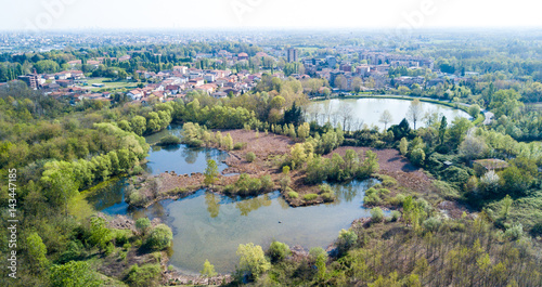 Natura e paesaggio: vista aerea di un bosco e di laghi, verde ed alberi in un paesaggio di natura selvaggia. Parco delle Groane, località di Mombello (Laghettone), Limbiate, Milano, Italia photo