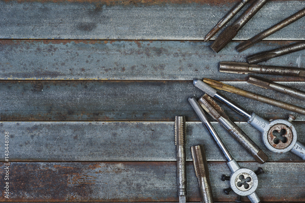 Set of various equipment for threading with copy space, carpenter tool old rusty metal background. Set of various equipment for threading with copy space, carpenter tool old rusty metal background.