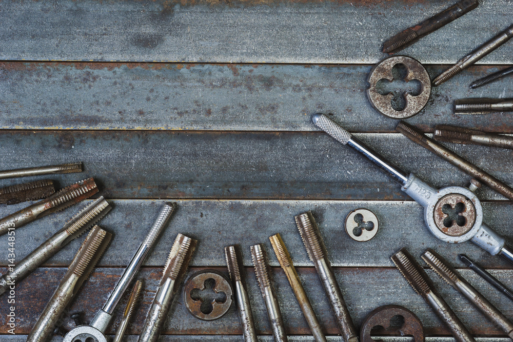 Set of various equipment for threading with copy space, carpenter tool old rusty metal background. Set of various equipment for threading with copy space, carpenter tool old rusty metal background.