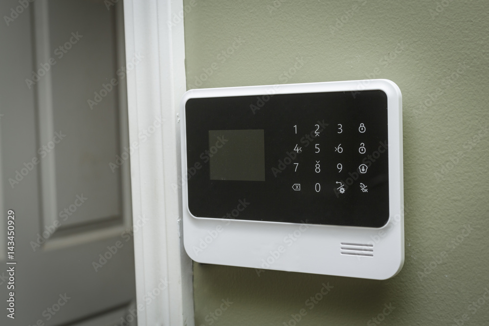 security system keypad beside an open door security system keypad beside an open door