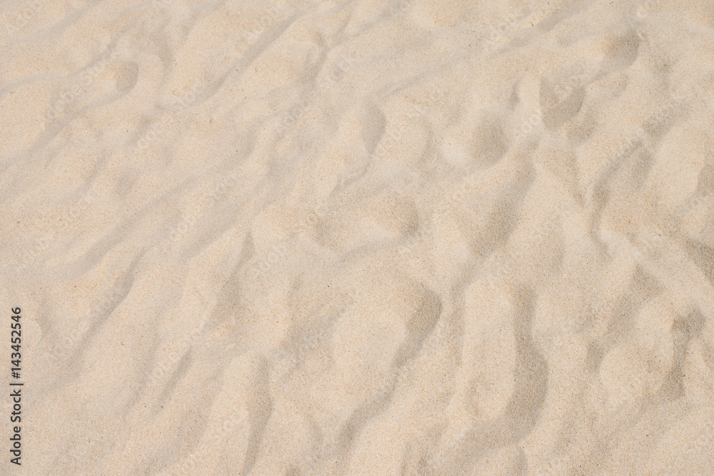 closeup of sand pattern of a beach in the summer closeup of sand pattern of a beach in the summer