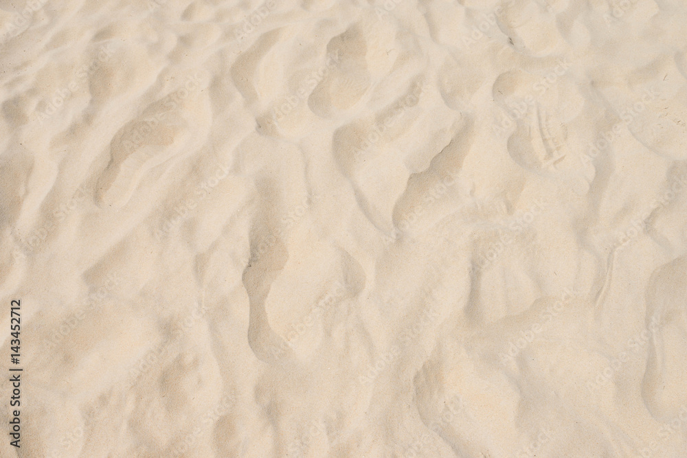 closeup of sand pattern of a beach in the summer closeup of sand pattern of a beach in the summer