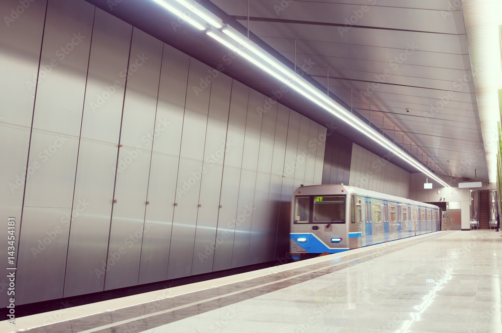 Arriving subway train at metro station