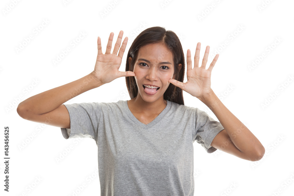 Young Asian woman sticking her tongue out. Young Asian woman sticking her tongue out.