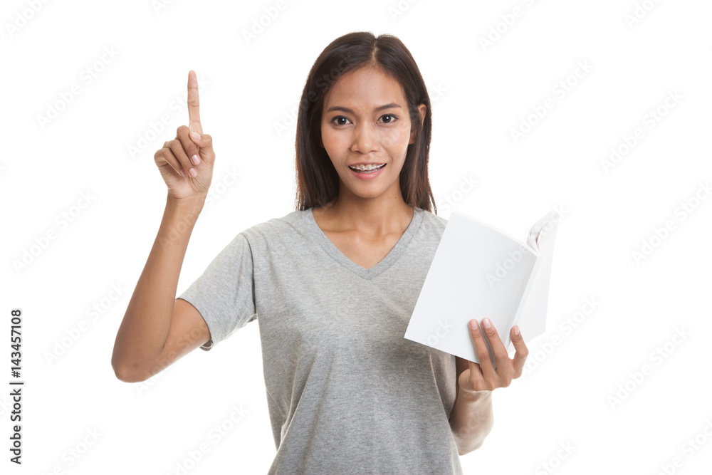 Young Asian woman with a book have an idea. Young Asian woman with a book have an idea.