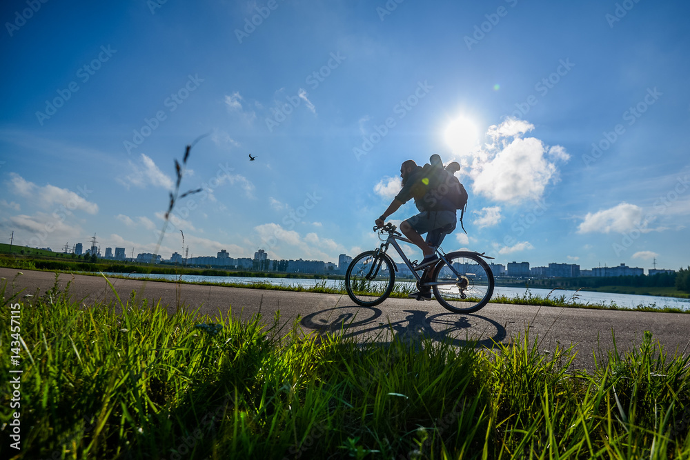 hipster man on a bicycle in the countryside hipster man on a bicycle in the countryside