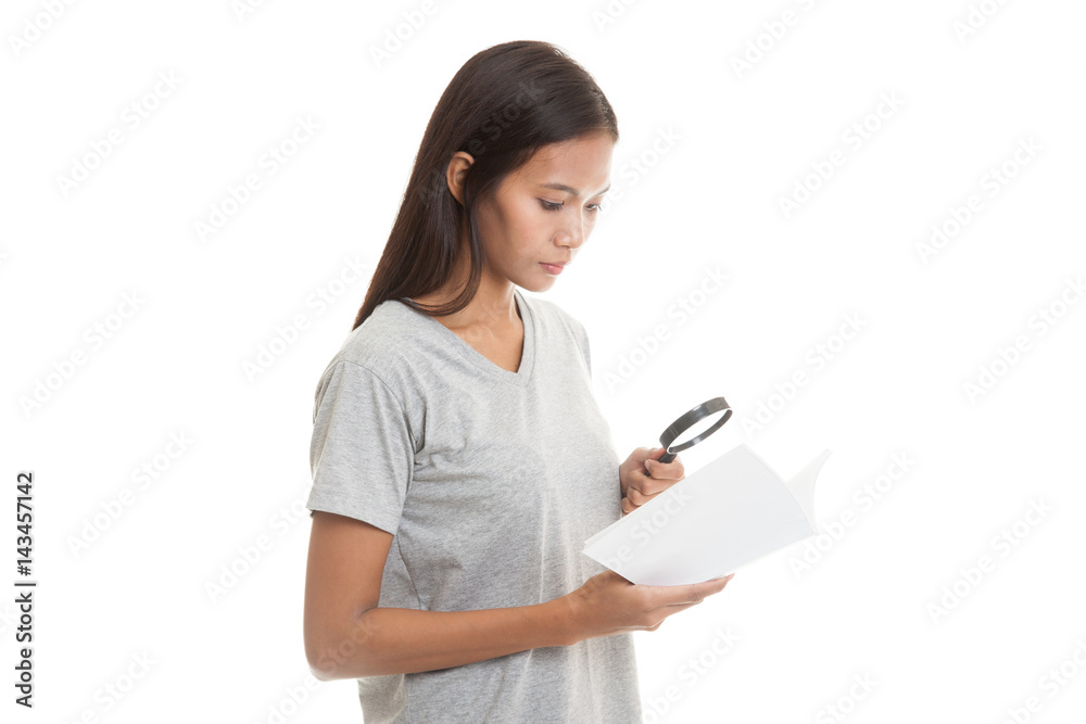 Asian woman with a book and magnifying glass. Asian woman with a book and magnifying glass.