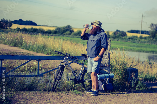 man drinks water on a halt