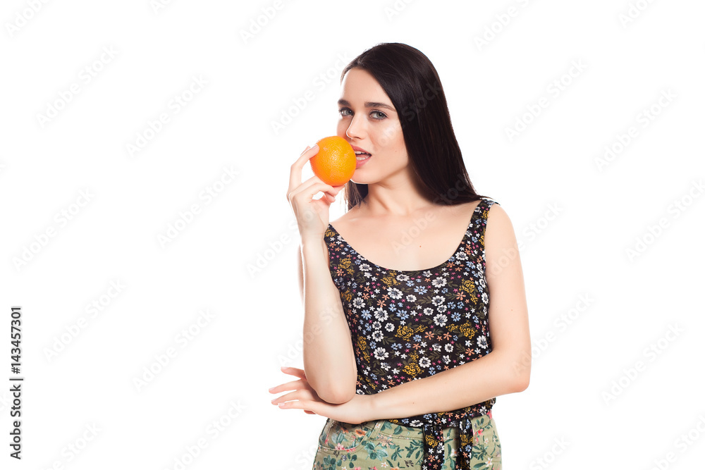 beautiful girl on a white background with an orange in hands, Space for text beautiful girl on a white background with an orange in hands, Space for text