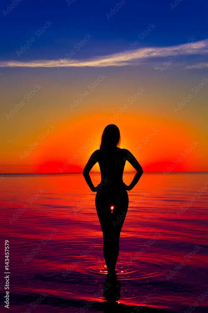 Girl silhouette on water