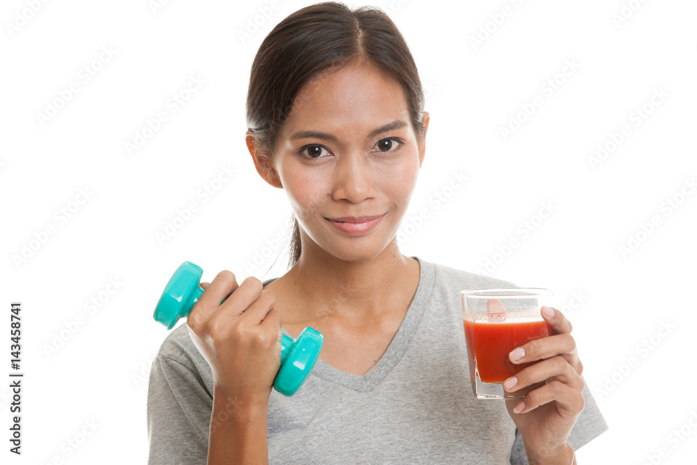 Healthy Asian woman with dumbbell and tomato juice. Healthy Asian woman with dumbbell and tomato juice.